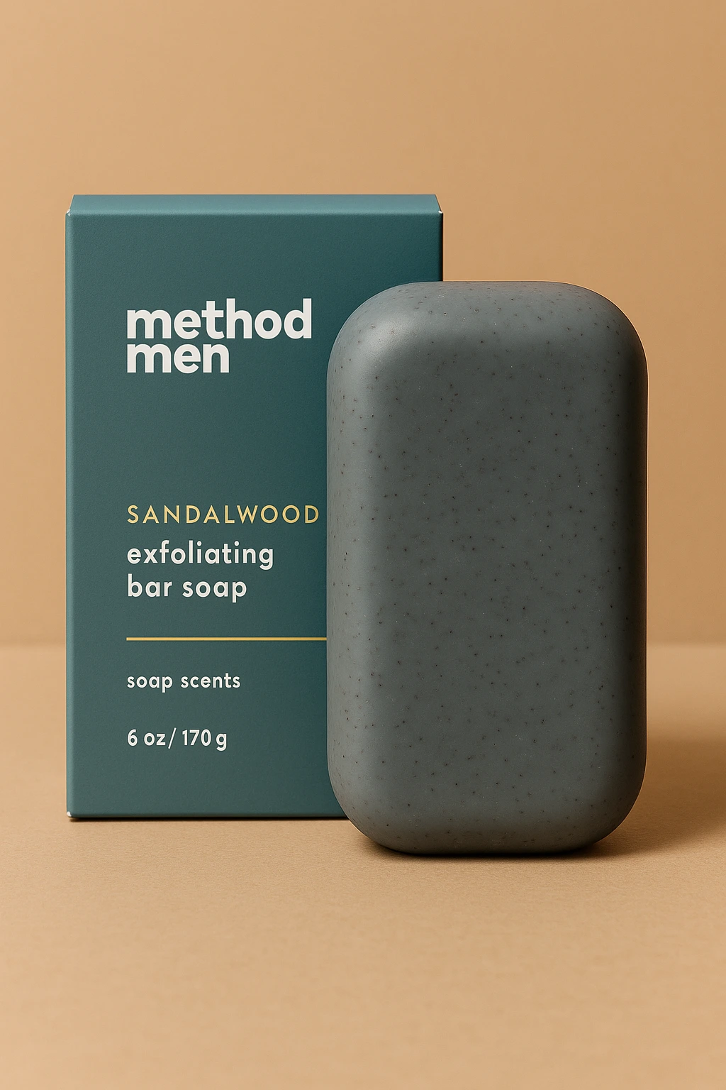 Method Men sandalwood exfoliating bar soap displayed with its teal packaging, showing the smooth grey bar with visible exfoliating particles