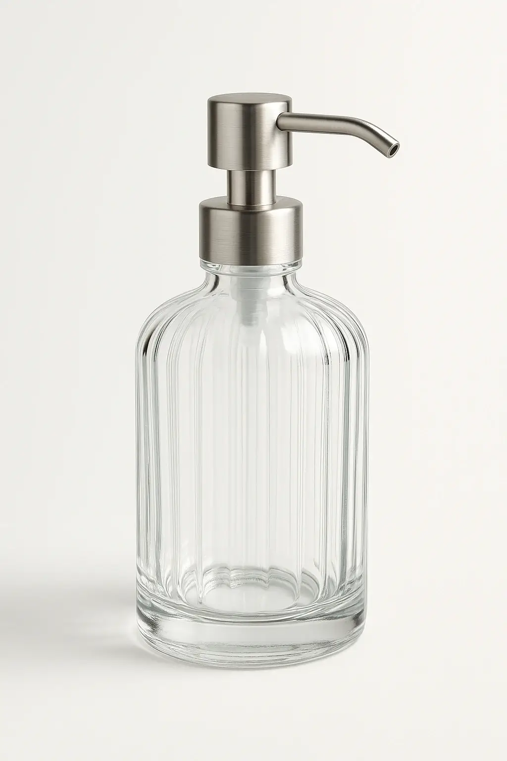 Williams Sonoma soap dispensers in glass, stainless, and marble designs arranged in a neutral kitchen setting